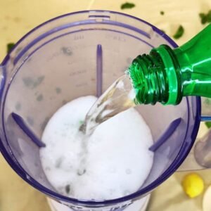 Adding Soda water in a blending jug